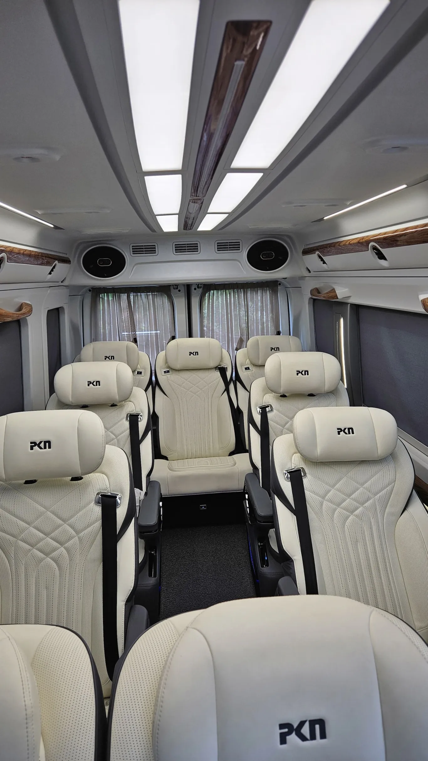 Premium Urbania 12 seater pushback interior with curtains